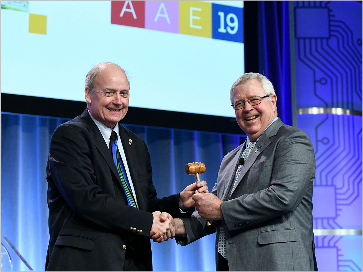Dr. Patrick E. Taylor formally passes the gavel to the AAE's new president, Dr. Keith V. Krell.