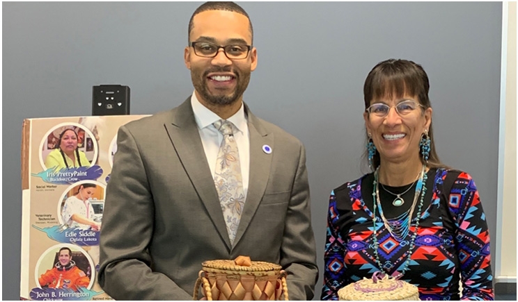 Trice Batson, diversity officer at KVCC, is holding a Potawatomi black ash basket made 60 years ago by the Whitepigeon grandparents. Dr. Rickert is displaying a Potawatomi black ash basket made by her sister, Nancy Krogmann.