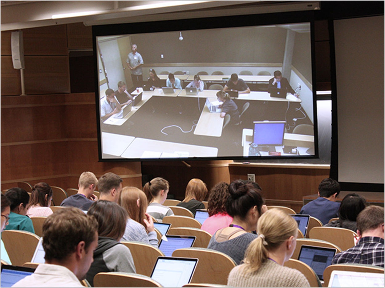 Distance-learning technology links dental students in Seattle to RIDE students at their Spokane hub on the Eastern Washington University campus.
