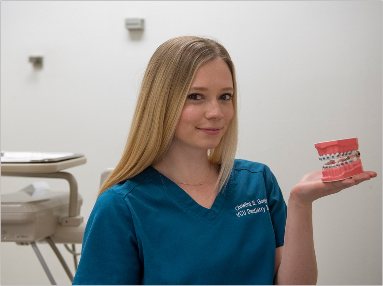 Christina Gordon, a VCU dental student, has invented a cleaning device for orthodontic patients who wear braces. Tom Kojcsich, University Marketing